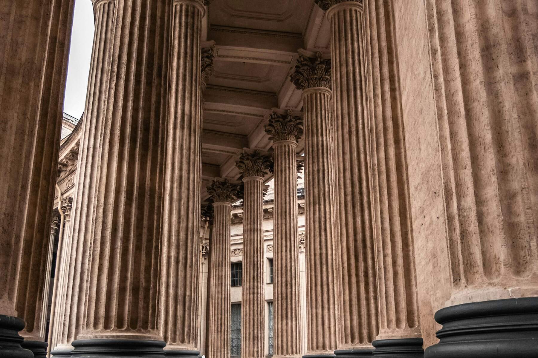 A monumental classical pillar, viewed from below